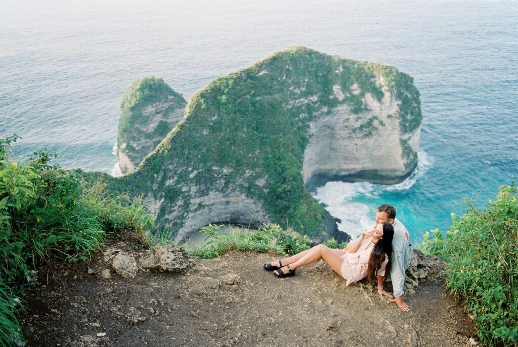 Tourists capturing photos at Kelingking Beach in Nusa Penida